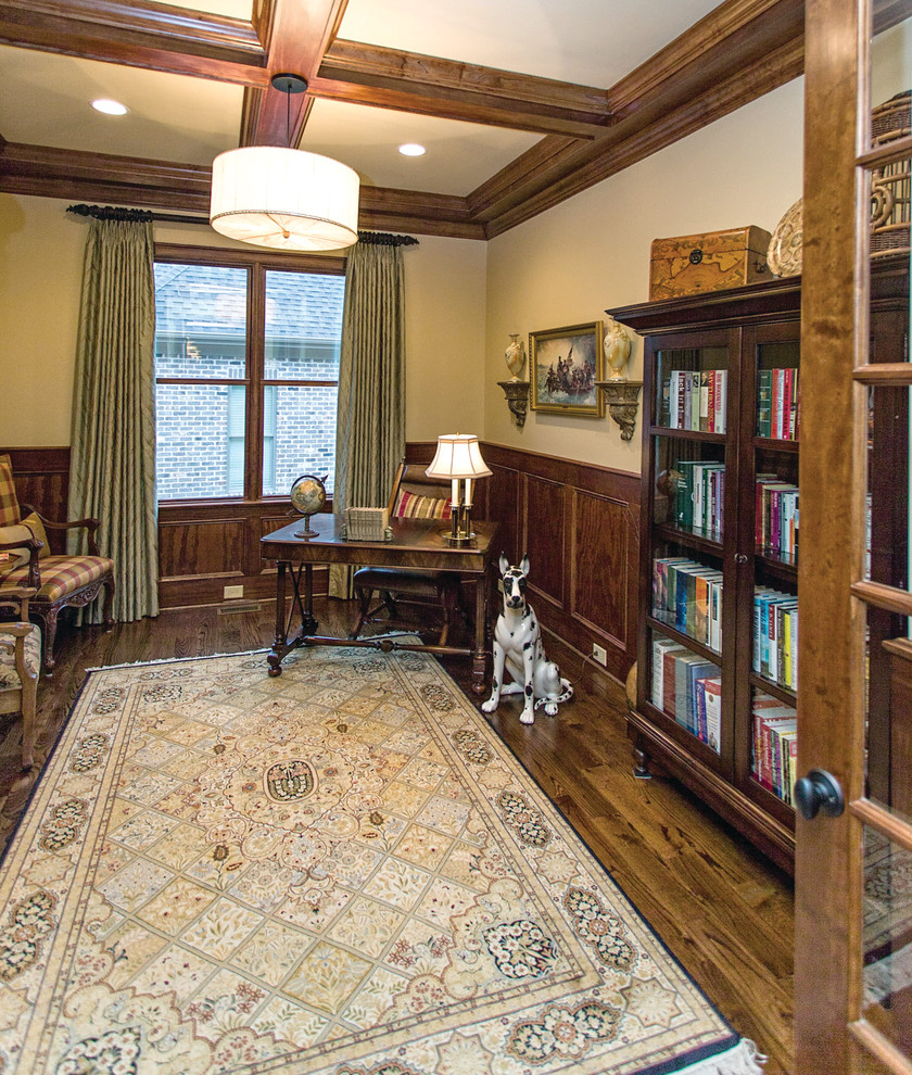 Study room - mid-sized traditional freestanding desk dark wood floor study room idea in Other with beige walls and no fireplace