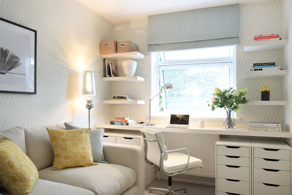Study room - mid-sized transitional built-in desk study room idea in London with multicolored walls