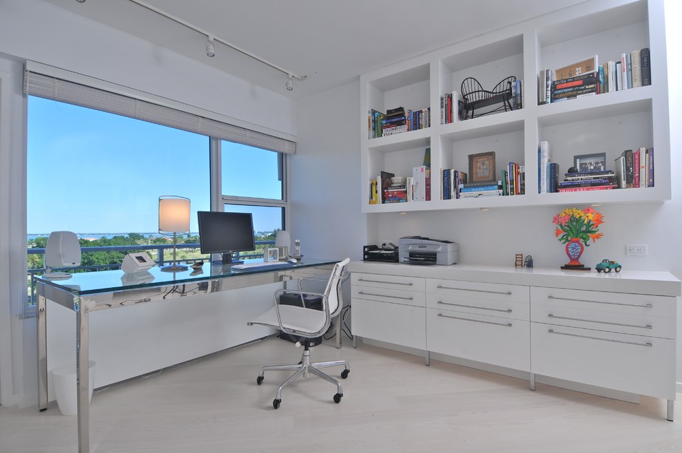Design ideas for a contemporary home office in Tampa with white walls.