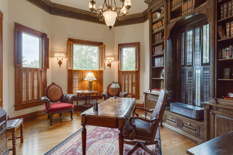 Photo of a medium sized victorian home office in Dallas with a reading nook, white walls, medium hardwood flooring, a freestanding desk and brown floors.