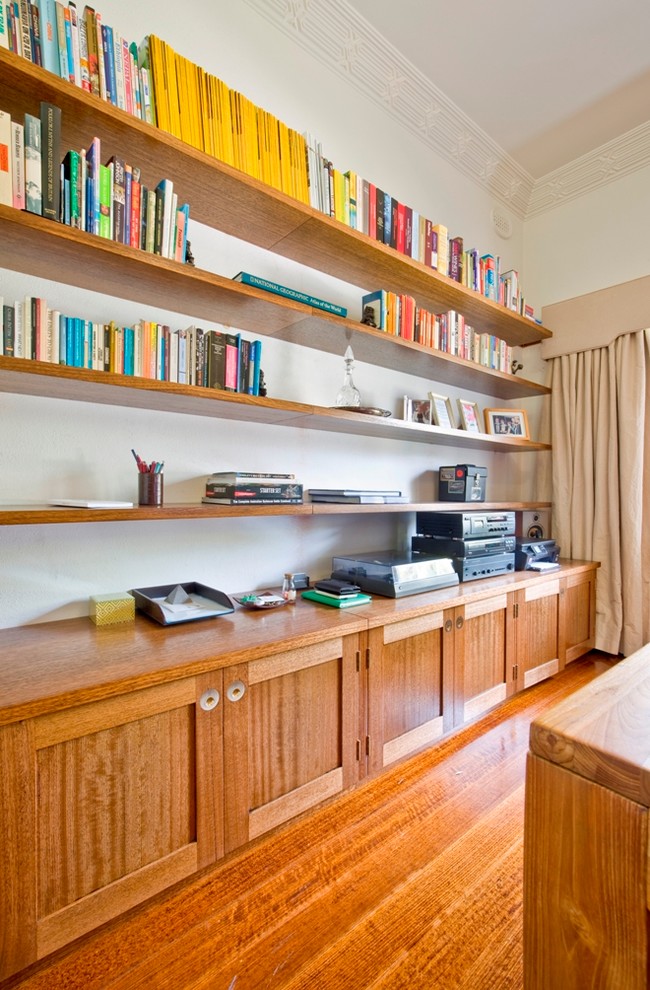 Large trendy freestanding desk medium tone wood floor study room photo in Melbourne with white walls and no fireplace