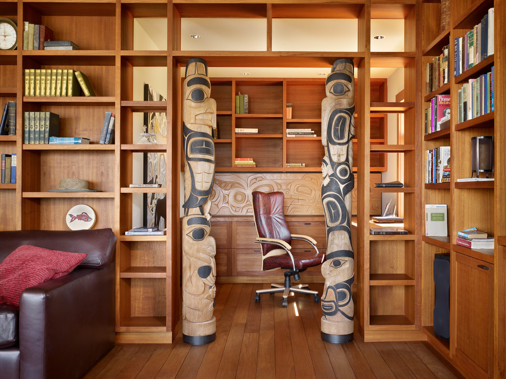 Photo of a world-inspired home office in Seattle with a built-in desk.