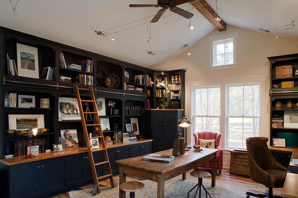 Photo of a large rustic home office in Charleston with white walls, medium hardwood flooring and a freestanding desk.