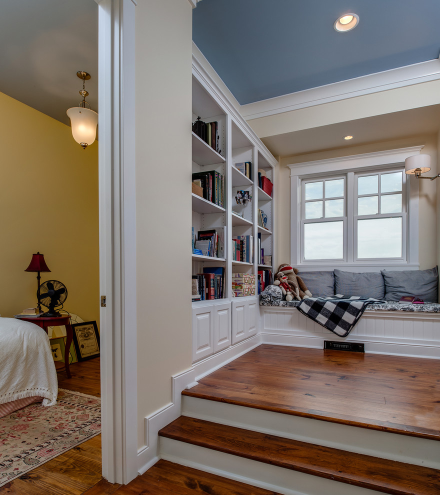 Mid-sized arts and crafts gender-neutral medium tone wood floor and brown floor kids' study room photo in Other with beige walls