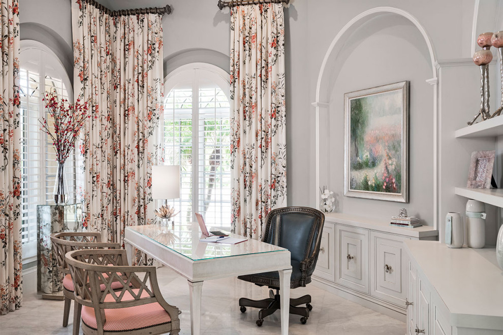Design ideas for a large mediterranean home office in Miami with a freestanding desk.