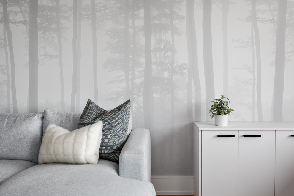 Photo of a medium sized beach style study in Vancouver with grey walls, medium hardwood flooring, a built-in desk, brown floors and wallpapered walls.