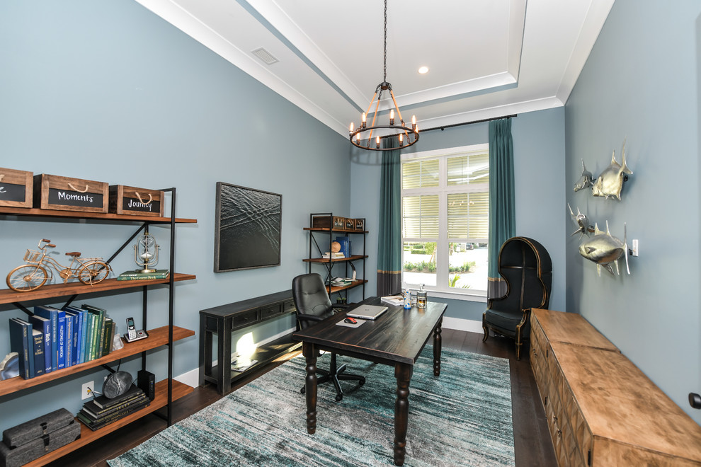 Photo of a medium sized beach style home office in Tampa with blue walls, medium hardwood flooring, no fireplace, a freestanding desk and brown floors.