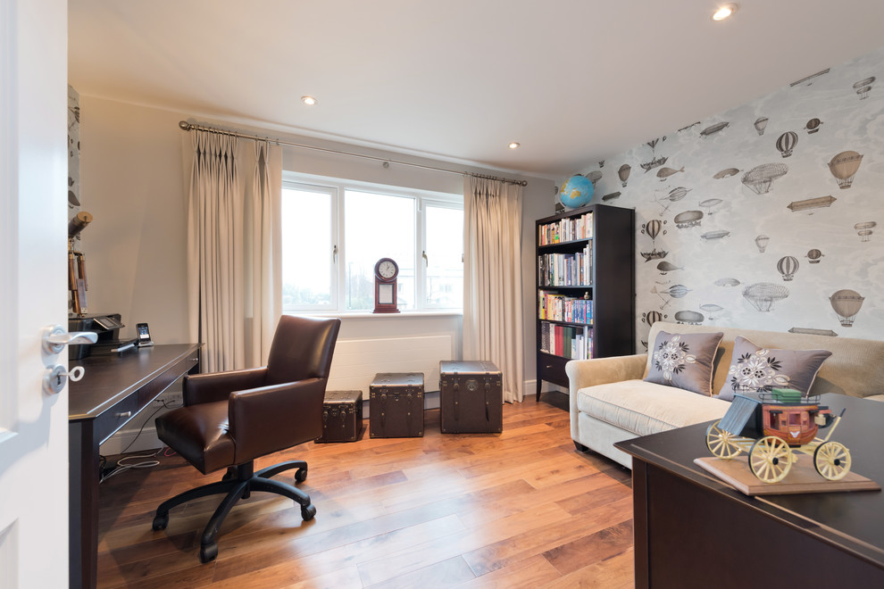 Example of a trendy home office design in Dublin