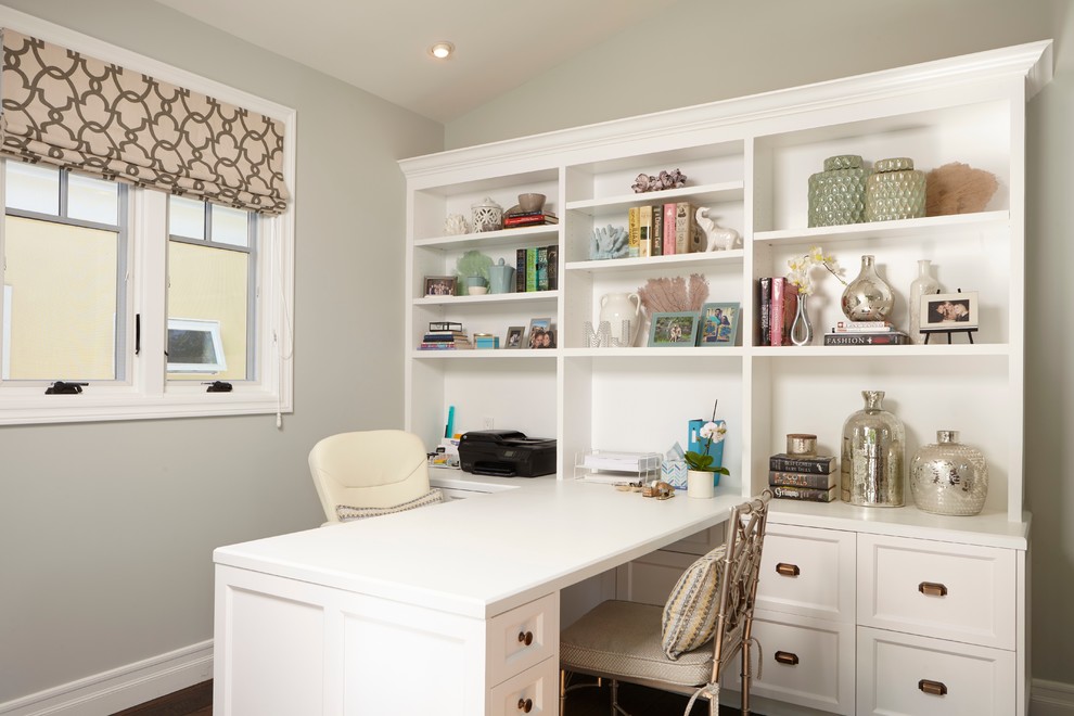 Example of a mid-sized transitional built-in desk dark wood floor home office design in Los Angeles with gray walls