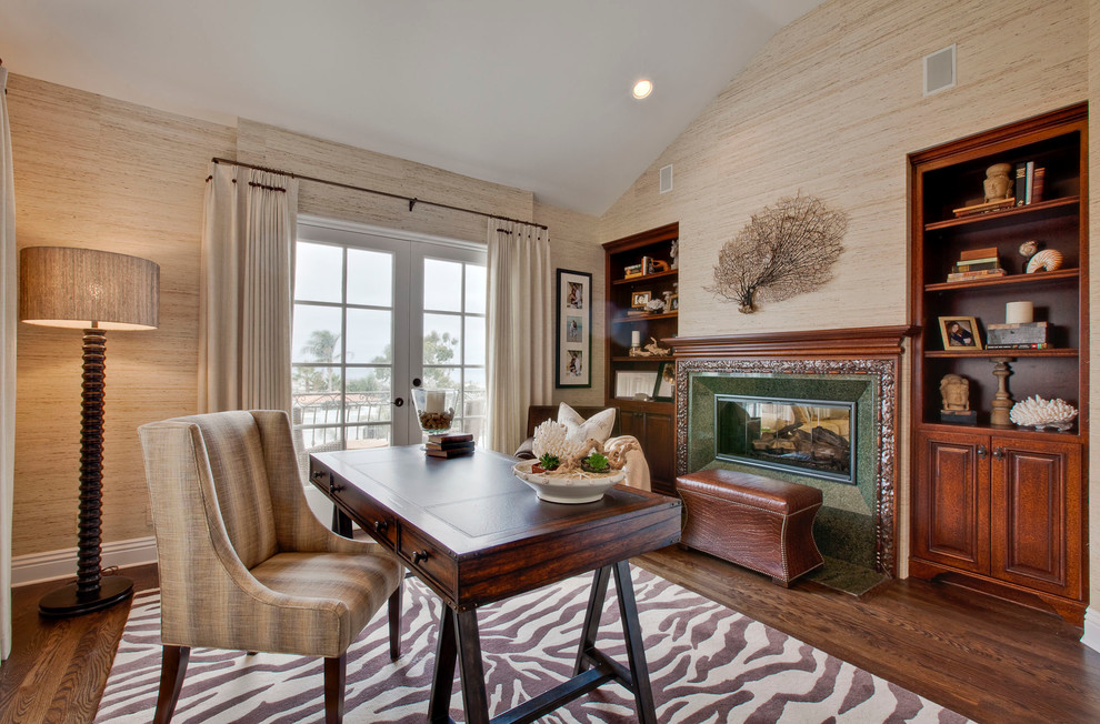 Inspiration for a timeless freestanding desk dark wood floor home office remodel in Los Angeles with a standard fireplace