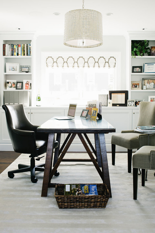 Design ideas for a nautical study in Los Angeles with white walls and a freestanding desk.