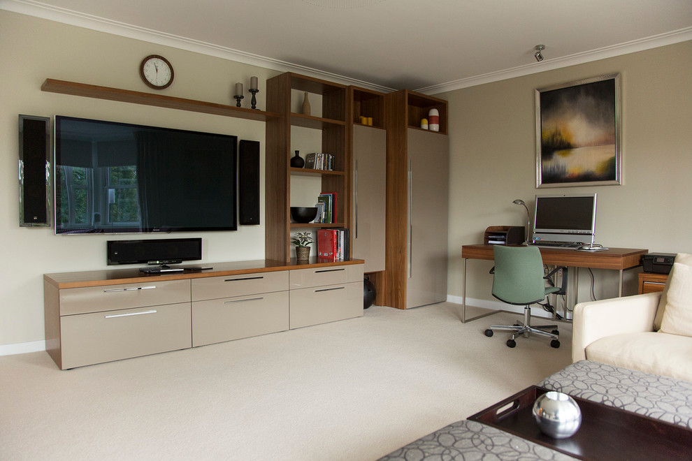 Home office - mid-sized contemporary carpeted home office idea in London with gray walls and no fireplace