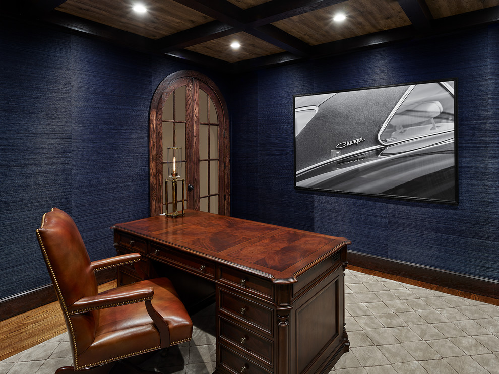 Inspiration for a mid-sized timeless freestanding desk medium tone wood floor and brown floor study room remodel in DC Metro with blue walls and no fireplace