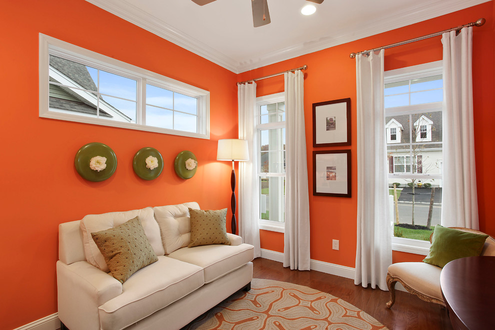 Inspiration for a mid-sized study room remodel in New York with orange walls
