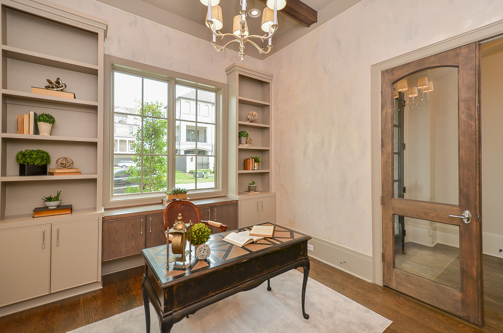 Medium sized classic study in Houston with beige walls, dark hardwood flooring, no fireplace, a freestanding desk and brown floors.