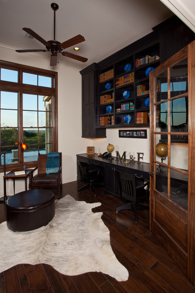 Home office - traditional built-in desk home office idea in Austin