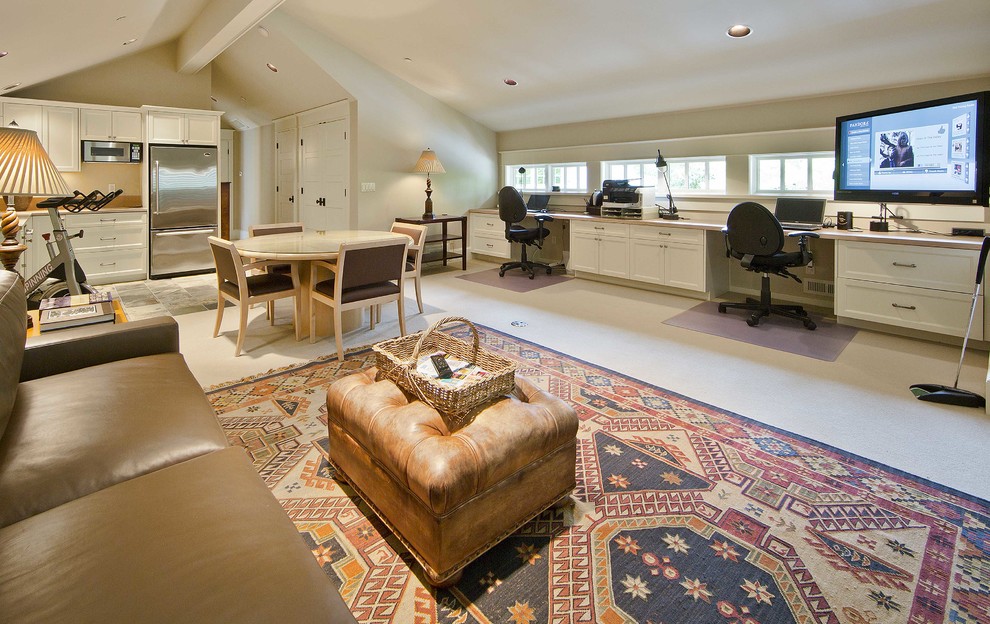 Photo of a large traditional study in Seattle with beige walls, carpet, no fireplace and a built-in desk.