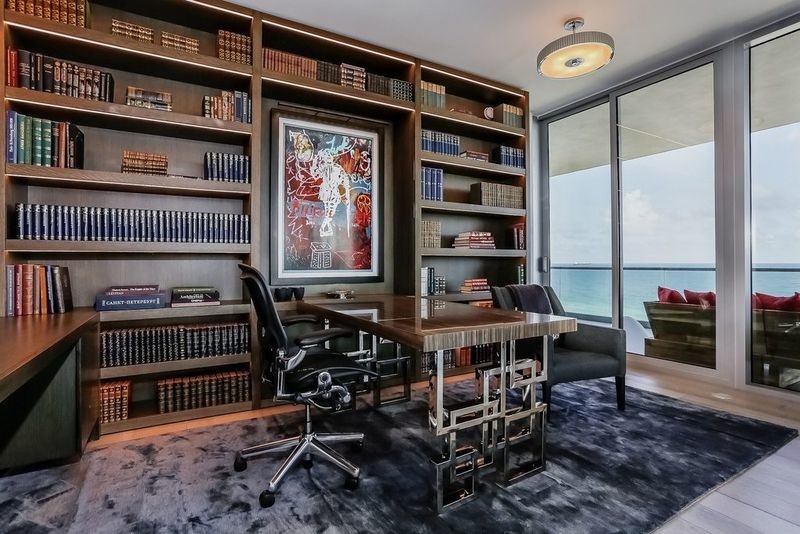 Example of a large minimalist freestanding desk home office library design in New York