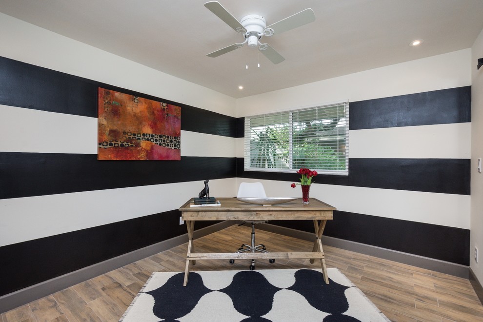 Inspiration for a mid-sized 1950s freestanding desk porcelain tile home office remodel in Phoenix with multicolored walls