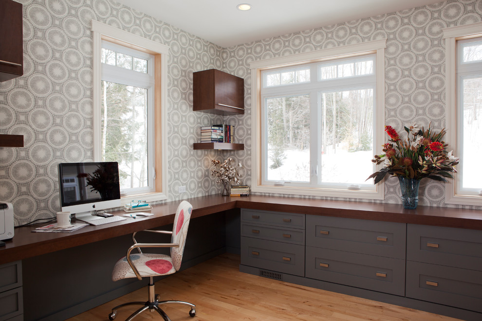 Inspiration for a traditional home office in Other with a built-in desk.
