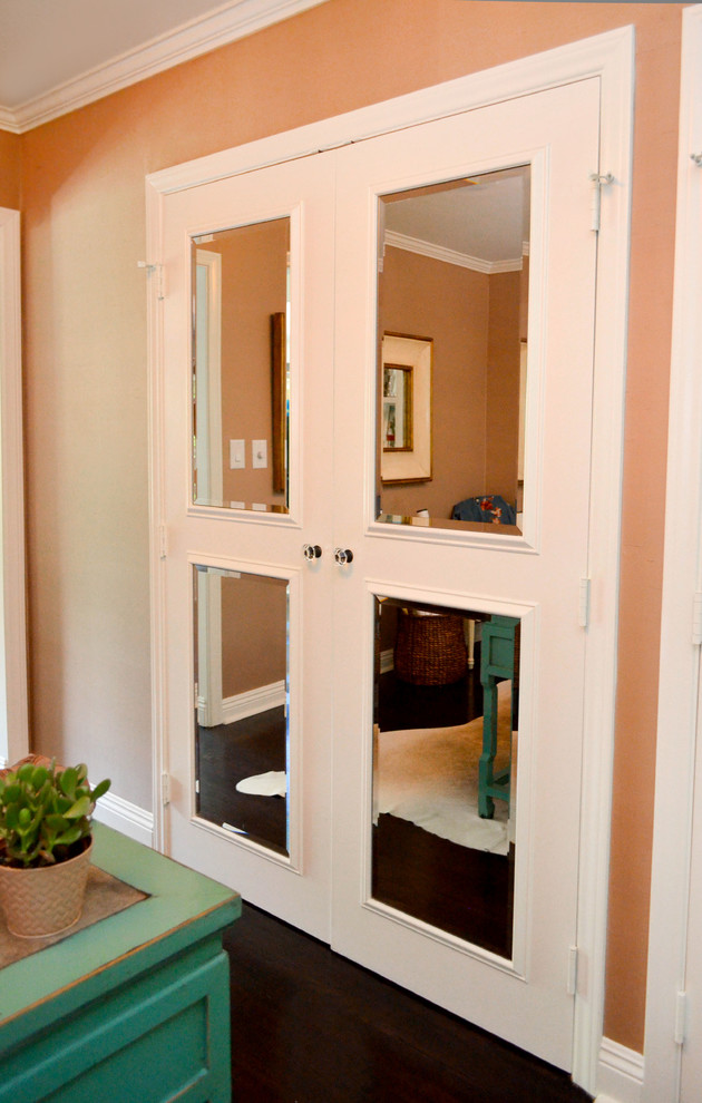 Study room - mid-sized freestanding desk dark wood floor and brown floor study room idea in Los Angeles with pink walls and no fireplace