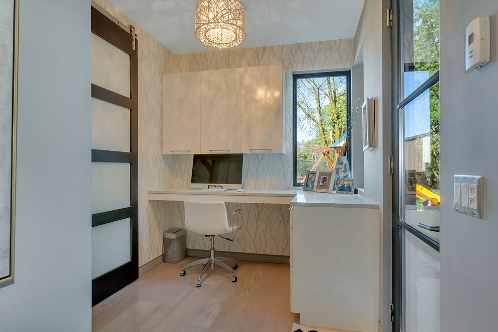 Inspiration for a small contemporary built-in desk light wood floor and beige floor study room remodel in Minneapolis with gray walls and no fireplace