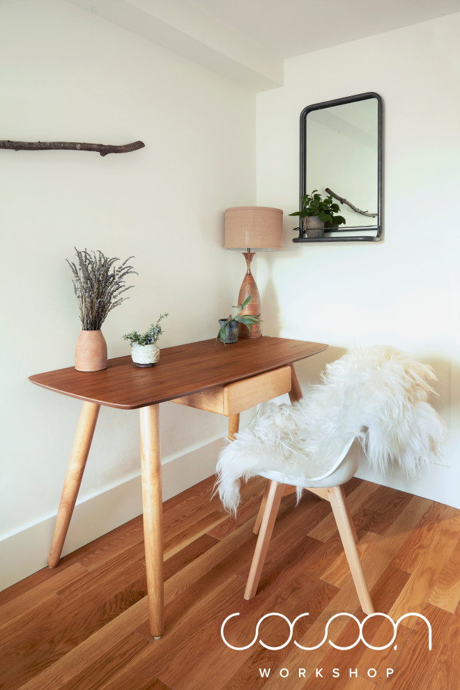 This is an example of a scandi study in San Francisco with white walls and a freestanding desk.