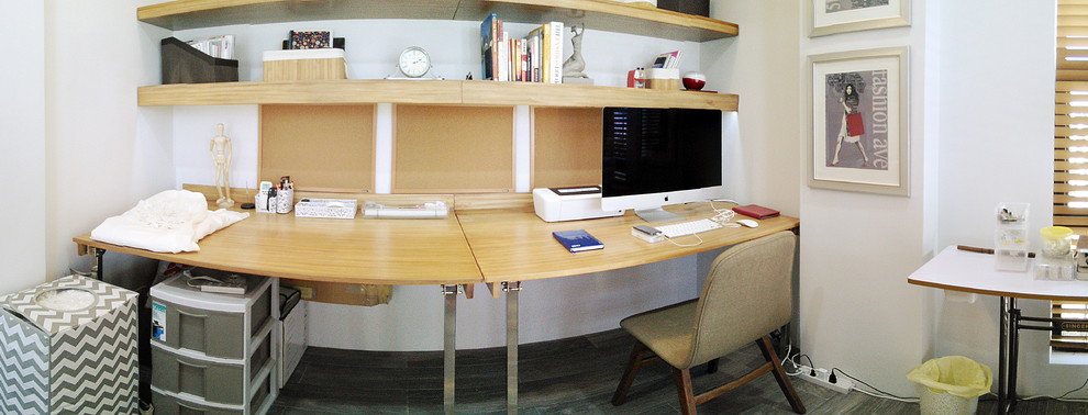 Photo of a medium sized world-inspired craft room in Other with white walls, porcelain flooring and a built-in desk.