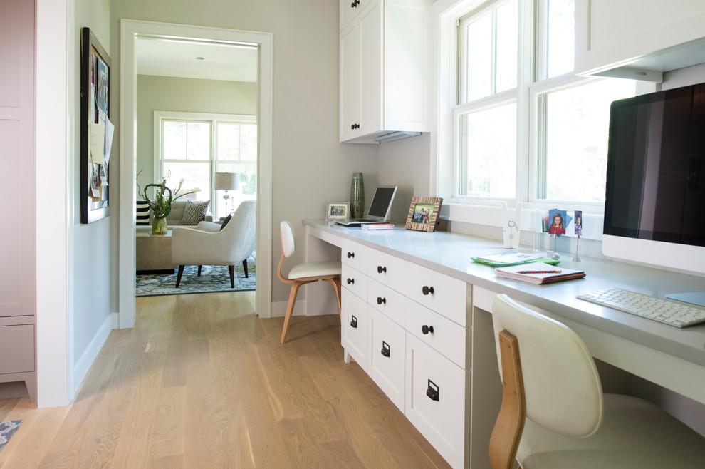 Design ideas for a nautical study in Minneapolis with light hardwood flooring and grey walls.