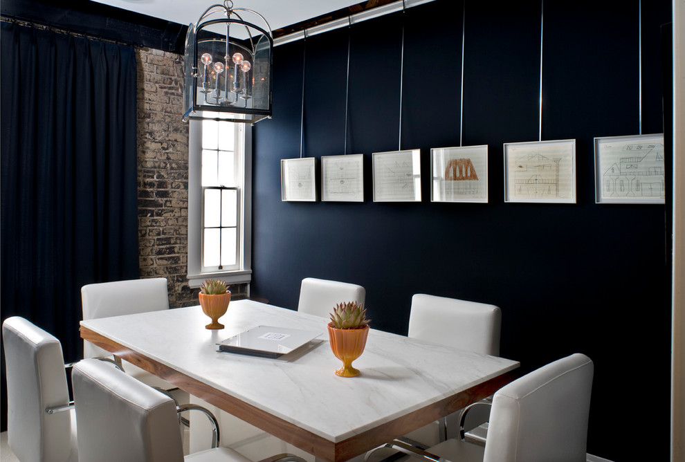 Transitional dining room photo in New Orleans with black walls