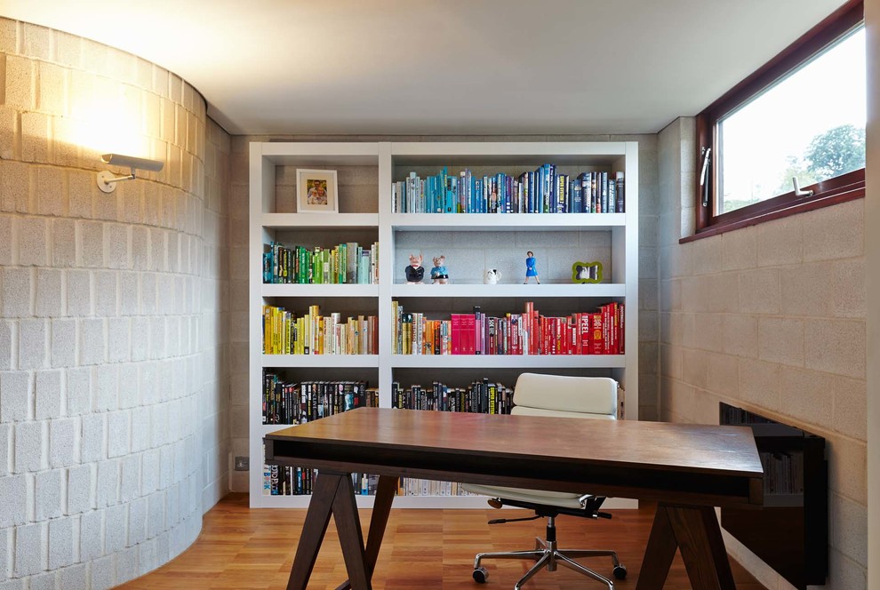 Photo of a medium sized contemporary study in Hampshire with grey walls, medium hardwood flooring and a freestanding desk.