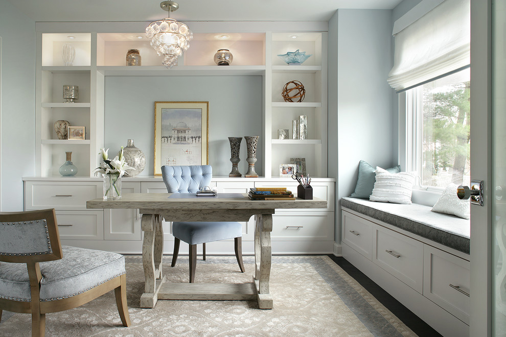 Inspiration for a transitional home office remodel in New York with blue walls