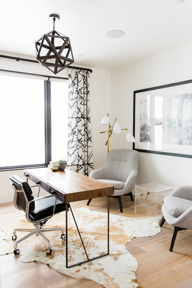 Transitional freestanding desk light wood floor study room photo in Salt Lake City with white walls and no fireplace