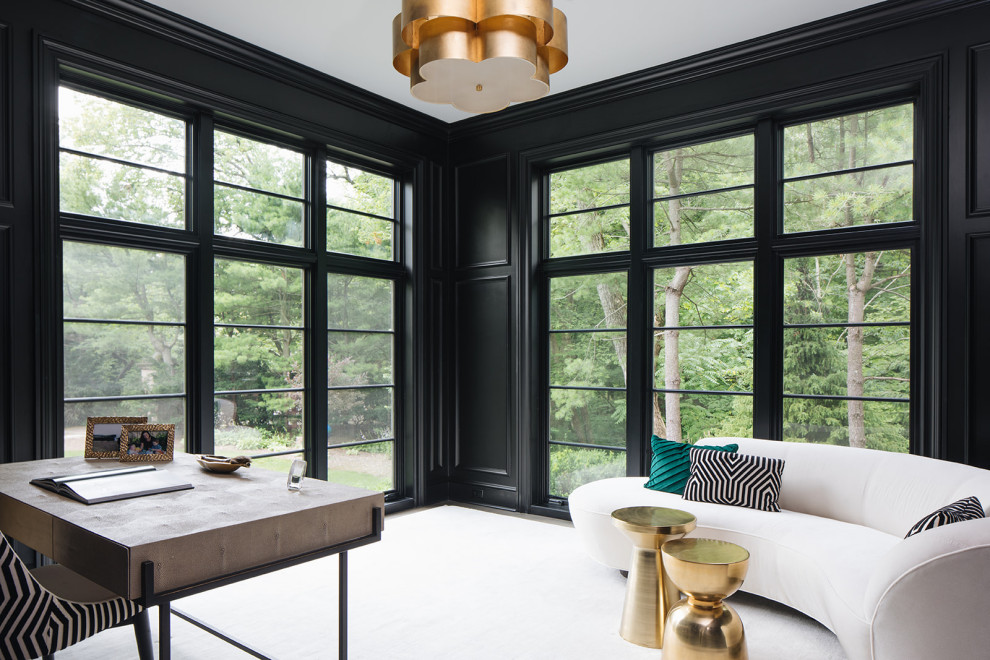 Inspiration for a transitional freestanding desk home office remodel in Chicago with black walls