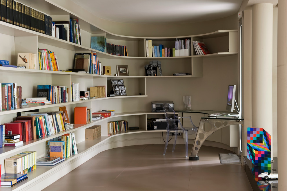 Inspiration for a contemporary built-in desk concrete floor home office remodel in Other
