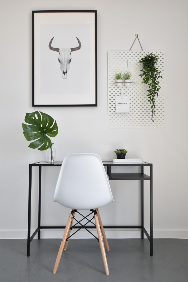 Study room - small scandinavian freestanding desk laminate floor and gray floor study room idea in London with white walls