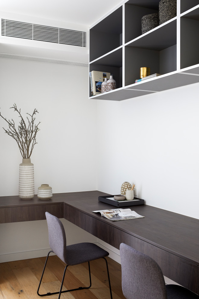 Minimalist home office photo in Melbourne