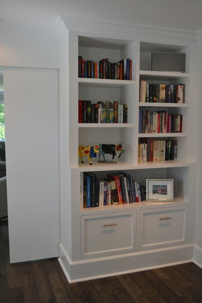 Example of a trendy medium tone wood floor home office design in New York with gray walls