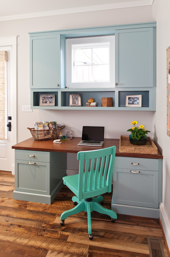 Photo of a medium sized rustic home office in Richmond with medium hardwood flooring, a built-in desk, grey walls and no fireplace.