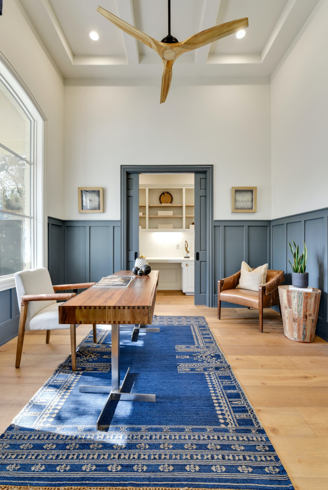 Inspiration for a traditional study in Austin with grey walls, medium hardwood flooring, a freestanding desk, beige floors, wainscoting, panelled walls, no fireplace and a coffered ceiling.
