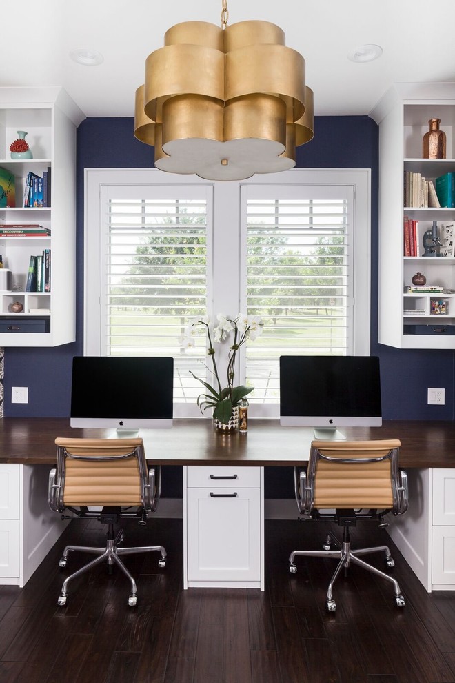 Inspiration for a medium sized classic craft room in Austin with blue walls, dark hardwood flooring, no fireplace, a built-in desk and brown floors.