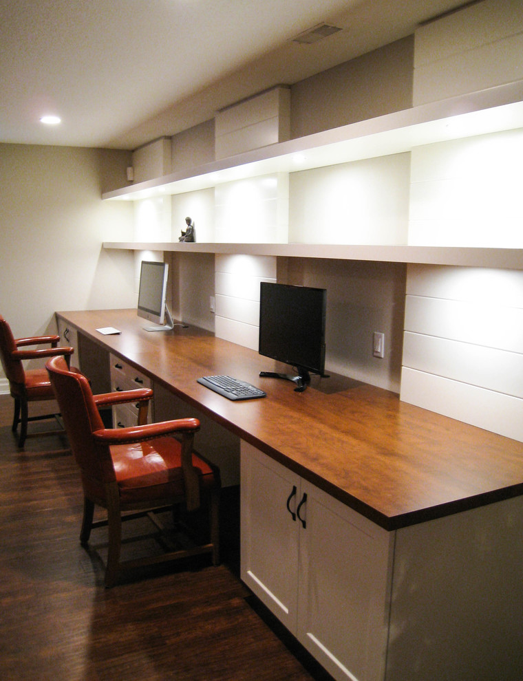 This is an example of a classic home office in Toronto with grey walls, vinyl flooring and brown floors.