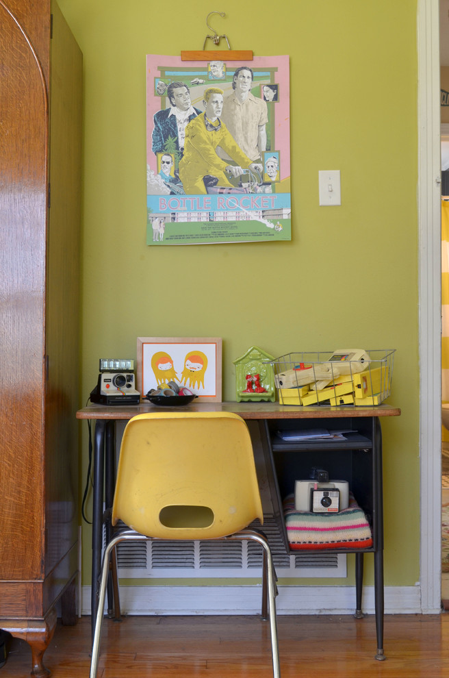 Inspiration for an eclectic light wood floor home office remodel in Dallas with green walls