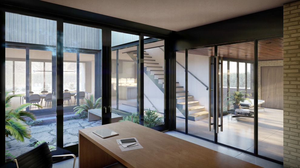 Источник вдохновения для домашнего уюта: кабинет в стиле модернизм с полом из керамогранита, серым полом, отдельно стоящим рабочим столом и кирпичными стенами