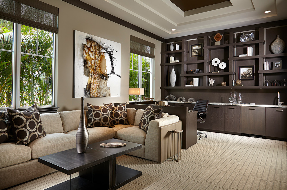 Design ideas for a large classic study in Miami with carpet, a built-in desk, beige walls and beige floors.
