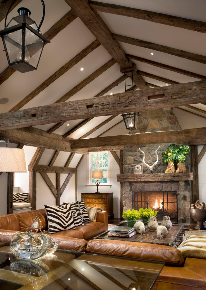 Inspiration for a large timeless dark wood floor study room remodel in New York with white walls and a stone fireplace