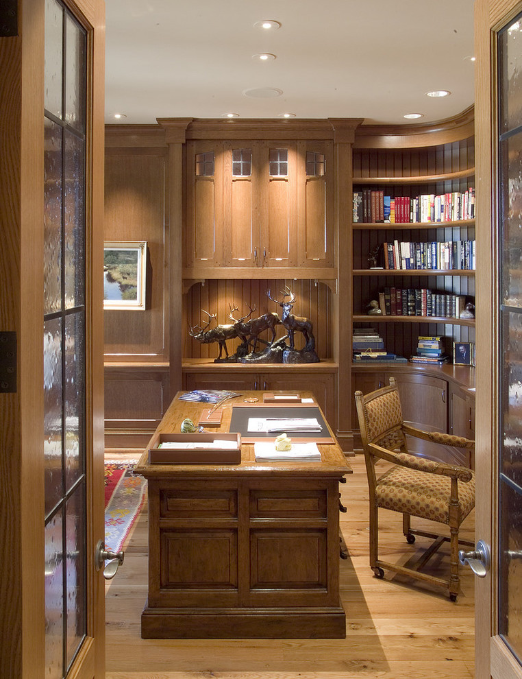 Classic home office in Minneapolis with medium hardwood flooring and a freestanding desk.