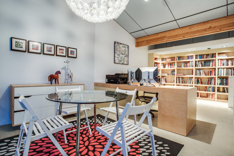 Example of a small minimalist built-in desk linoleum floor home studio design in Dallas with gray walls