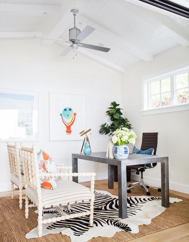 Home office - coastal medium tone wood floor home office idea in Orange County with white walls