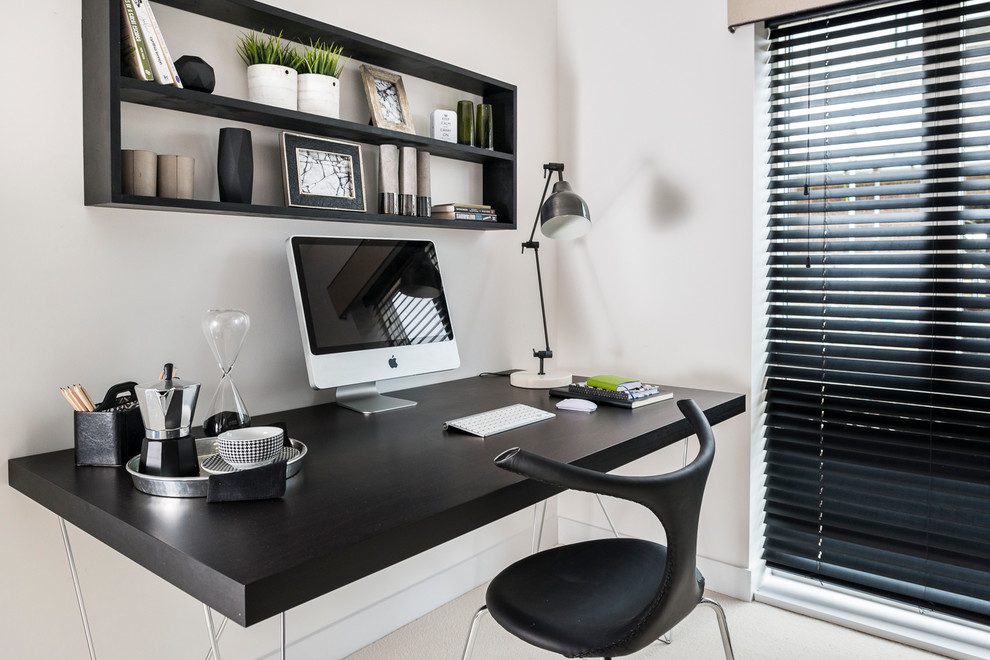 Small trendy freestanding desk beige floor study room photo in Hampshire with white walls